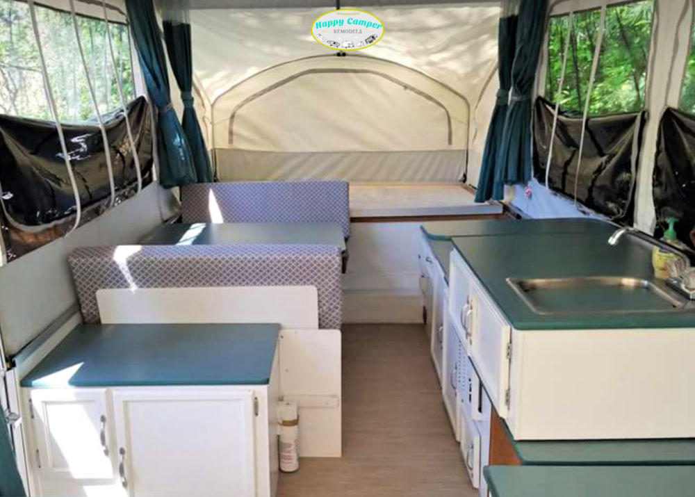 remodeled 1999 Viking pop up camper with white cabinets and green counters