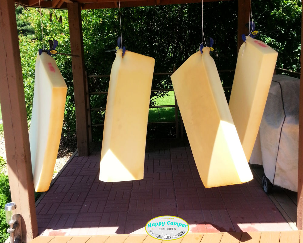 Airing out and cleaning musty camper cushions - hanging out to dry