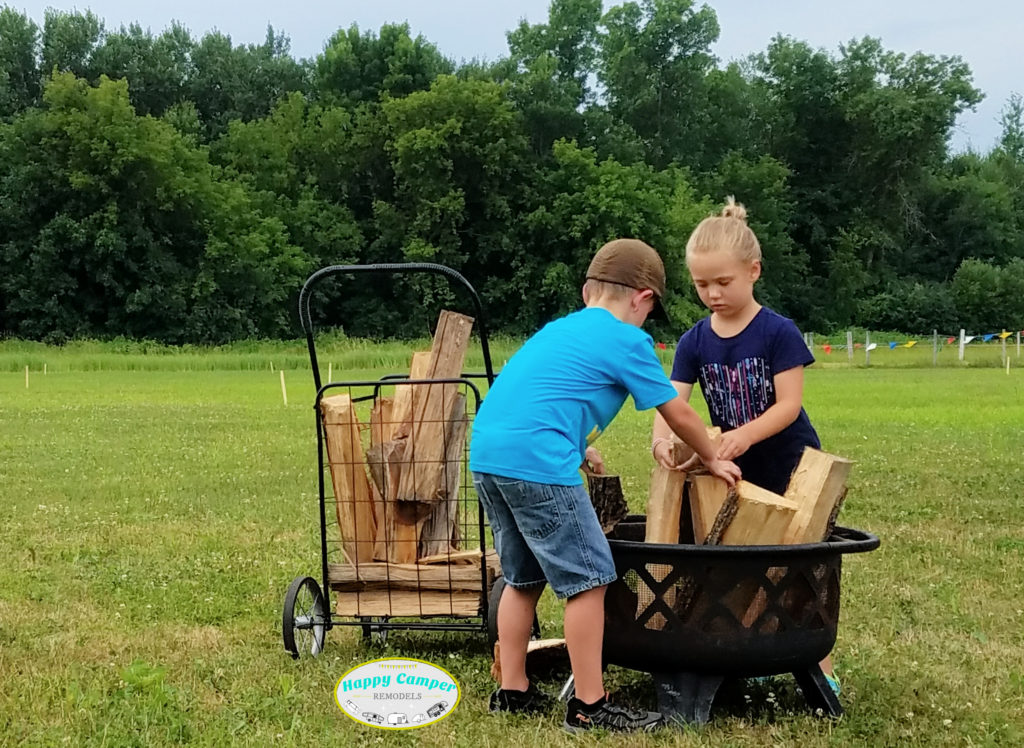 kids building a fire in the firepit