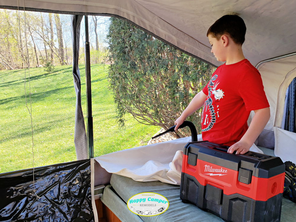 cleaning the pop up camper with Milwaukee vacuum